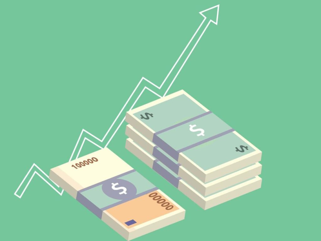 Dinheiro empilhados com seta simbolizando crescimento do dinheiro investido.