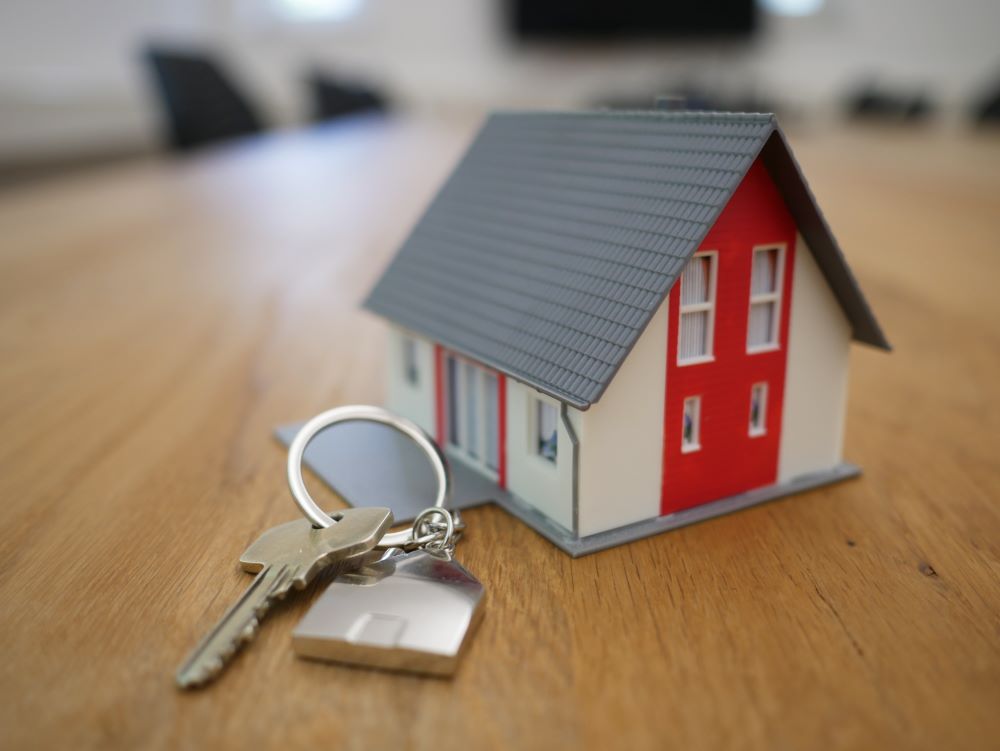 Imagem com uma casa e as chaves, compra.